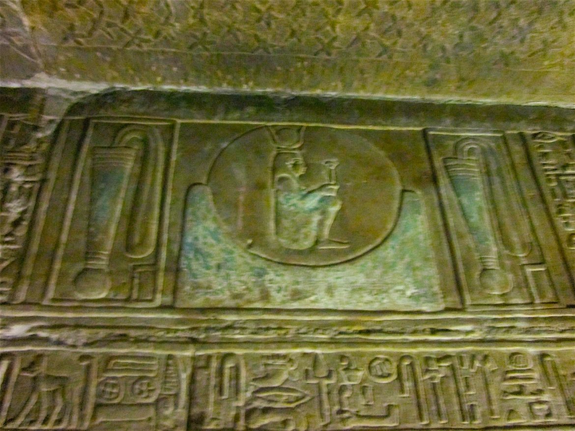 Hathor sat in the Akhet sign with her sistrum, and between the two Menat collars of protection Denderah temple by Antoine Gigal